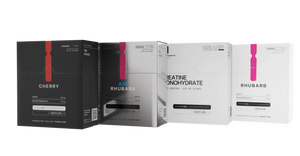 The four SYSTEM 001 boxes angled in a row: Cherry, Air, creatine and Rhubarb